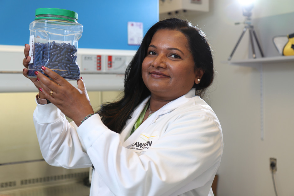 Seema Nair Parvathy (PhD), Research Coordinator with Lawson Health Research Institute, holds up fecal transplant capsules being used at St. Joseph’s Health Care London to treat patients with C. difficile and to study their potential use for many other health conditions.