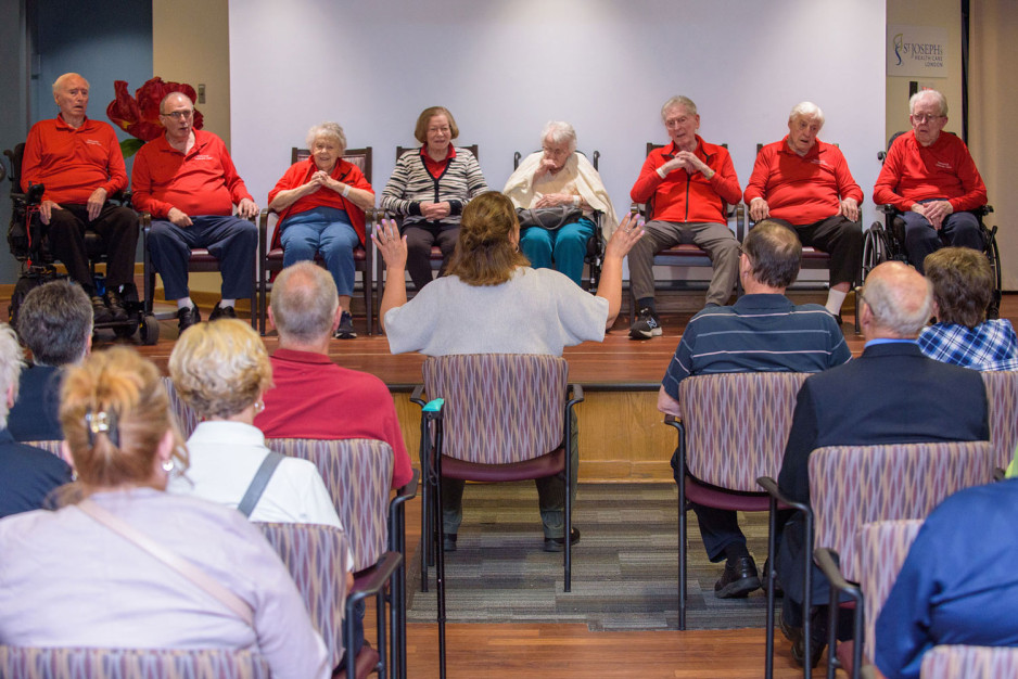 members of the Veterans choir performing on stage