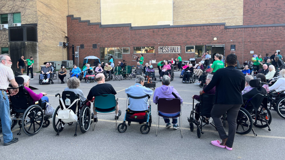 Mount Hope residents and volunteers forming a circle in a parking lot