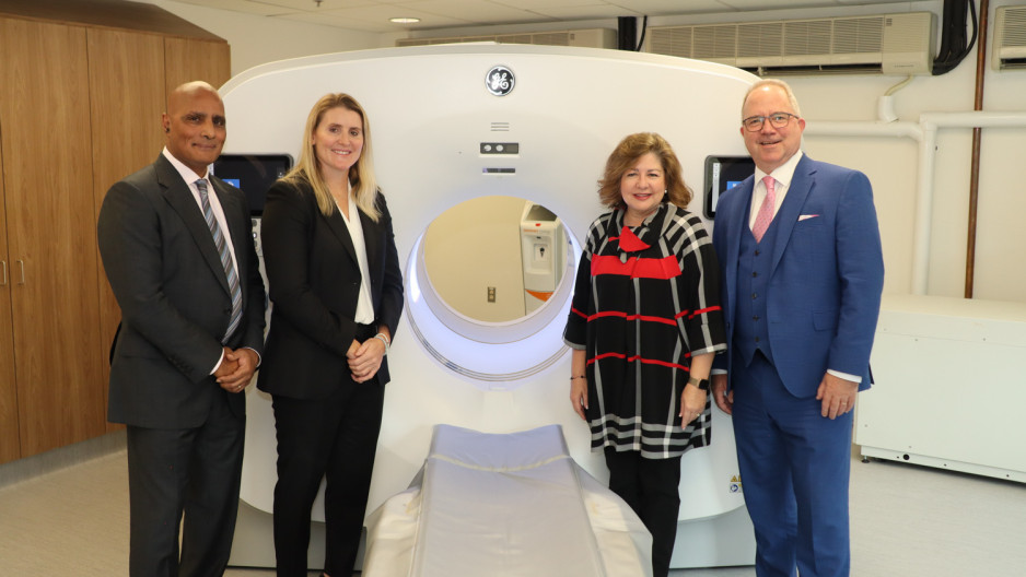 Dr. Narinder Paul, Hayley Wickenheiser, Michelle Campbell and Roy Butler pose in front of the PET/CT