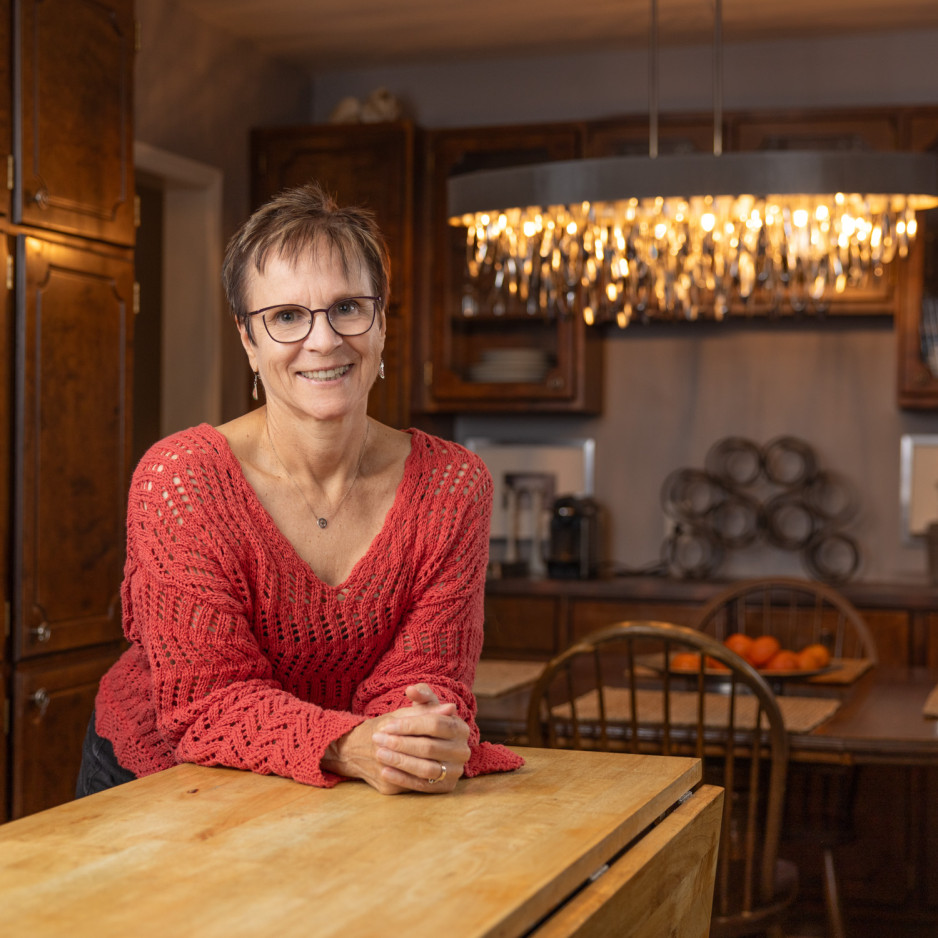 Micheline leaning up against a counter