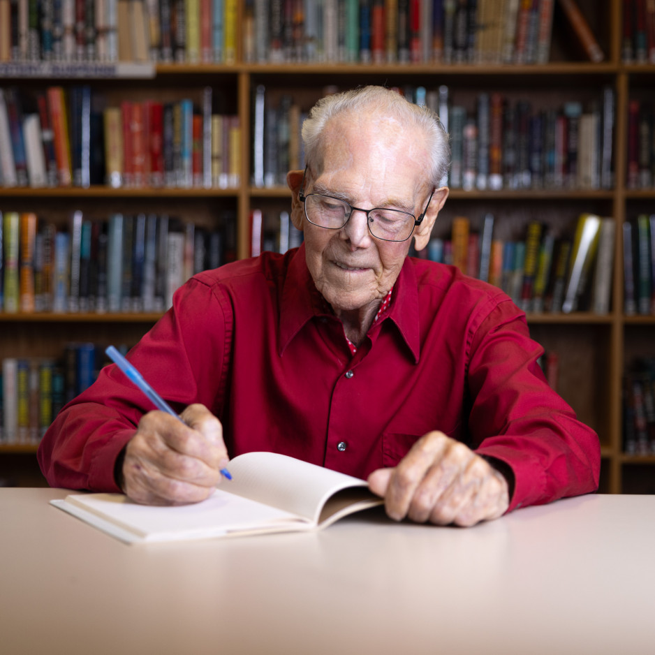 Tex writing in his notebook